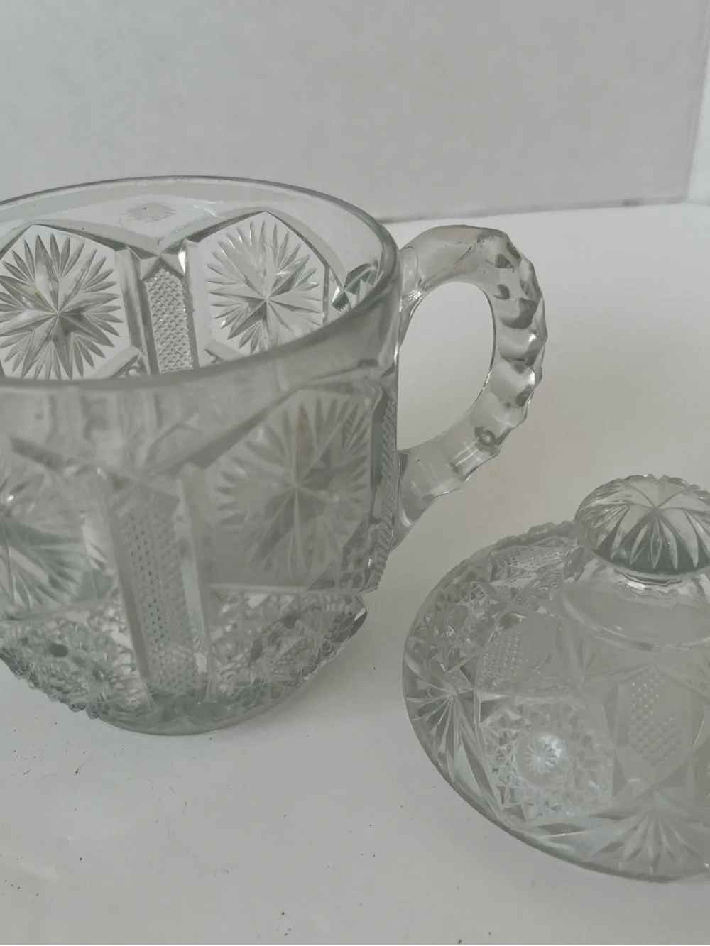 This is a vintage clear pressed-glass covered sugar bowl with 2 handles & lid